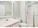 Bathroom featuring a glass-enclosed shower and vanity with decorative mirror and faucet at 488 River Oaks Dr. # 61N, Myrtle Beach, SC 29579