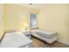 Bedroom with twin beds, side table, and lamp, offering a comfortable and functional space at 488 River Oaks Dr. # 61N, Myrtle Beach, SC 29579