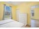 Bright bedroom with a window view, featuring a dresser and wood-look flooring at 488 River Oaks Dr. # 61N, Myrtle Beach, SC 29579
