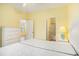 Bedroom boasts twin beds, a dresser, light wood flooring, and access to an ensuite bathroom at 488 River Oaks Dr. # 61N, Myrtle Beach, SC 29579
