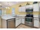 Well-equipped kitchen boasts stainless steel appliances, white cabinets, and counter space at 488 River Oaks Dr. # 61N, Myrtle Beach, SC 29579