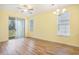 Sunny living space features light wood flooring, sliding glass doors, and natural light at 488 River Oaks Dr. # 61N, Myrtle Beach, SC 29579
