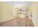 Open living space features light wood flooring, bright walls, and a view into the kitchen at 488 River Oaks Dr. # 61N, Myrtle Beach, SC 29579