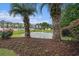 Scenic pond with a fountain, surrounded by landscaping at the River Oaks community at 488 River Oaks Dr. # 61N, Myrtle Beach, SC 29579