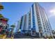 View of condominium complex with balconies and blue accents, plus a nearby Budget Inn at 504 N Ocean Blvd. # 1711, Myrtle Beach, SC 29577