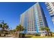 Bright, multistory condo building featuring numerous balconies and palm tree landscaping at 504 N Ocean Blvd. # 1711, Myrtle Beach, SC 29577