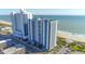 Exterior view of a beachfront condo with a parking area at 504 N Ocean Blvd. # 1711, Myrtle Beach, SC 29577
