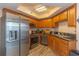 Modern kitchen featuring stainless steel appliances, wood cabinets, and sleek countertops at 504 N Ocean Blvd. # 1711, Myrtle Beach, SC 29577