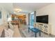Cozy condo living room with modern furniture, an open kitchen, and ocean views at 504 N Ocean Blvd. # 1711, Myrtle Beach, SC 29577