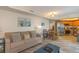 Comfortable living room featuring a cozy couch and an open floor plan to the kitchen at 504 N Ocean Blvd. # 1711, Myrtle Beach, SC 29577
