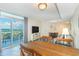 Condo living and dining area featuring balcony access, modern décor, and comfortable seating at 504 N Ocean Blvd. # 1711, Myrtle Beach, SC 29577