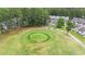 Aerial view of golf course with nearby townhomes and golf carts on the cart path at 511 Colonial Trace Dr. # 7-C, Longs, SC 29568