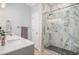 Sleek bathroom showcasing a glass-enclosed shower with marbled walls and a modern vanity at 511 Colonial Trace Dr. # 7-C, Longs, SC 29568