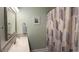 A bathroom featuring a sink with patterned backsplash and a shower with a geometric curtain at 511 Colonial Trace Dr. # 7-C, Longs, SC 29568