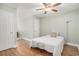 A light and airy bedroom featuring a wood-look floor, a ceiling fan, and a single bed at 511 Colonial Trace Dr. # 7-C, Longs, SC 29568