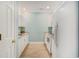 Galley kitchen featuring white appliances, granite countertops, and light-toned wood floors at 511 Colonial Trace Dr. # 7-C, Longs, SC 29568