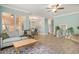 A bright and airy living space with a cozy seating area, open dining area, and a view of the kitchen at 511 Colonial Trace Dr. # 7-C, Longs, SC 29568