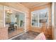 Bright sunroom showcasing a tile floor and offering a view into the dining room at 511 Colonial Trace Dr. # 7-C, Longs, SC 29568