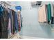 Walk-in closet with wire shelving and hanging clothes; a great storage space at 511 Colonial Trace Dr. # 7-C, Longs, SC 29568