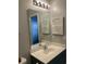 Bathroom featuring a large mirror, vanity sink, shuttered cabinet and light fixture at 5206 Sweetwater Blvd. # 5206, Murrells Inlet, SC 29576