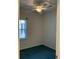 This bedroom features green carpet, a ceiling fan, and a window at 5206 Sweetwater Blvd. # 5206, Murrells Inlet, SC 29576