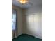 This bedroom features green carpet, a window, and a double door closet at 5206 Sweetwater Blvd. # 5206, Murrells Inlet, SC 29576