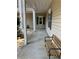 Inviting porch with a bench and green shutters on the window at 5206 Sweetwater Blvd. # 5206, Murrells Inlet, SC 29576