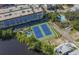 Aerial view showcasing tennis courts, parking, and landscaping near the property at 5300 N Ocean Blvd. N # 1120, Myrtle Beach, SC 29577