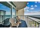 Relax on this condo's balcony, featuring comfortable seating and an ocean view at 5300 N Ocean Blvd. N # 1120, Myrtle Beach, SC 29577