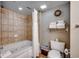 Well-lit bathroom with a tub/shower combo and tile surround at 5300 N Ocean Blvd. N # 1120, Myrtle Beach, SC 29577