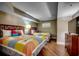 Comfortable bedroom featuring two beds, wood floors, and ample closet space at 5300 N Ocean Blvd. N # 1120, Myrtle Beach, SC 29577