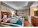 Comfortable bedroom featuring two beds, wood floors, and lots of natural light at 5300 N Ocean Blvd. N # 1120, Myrtle Beach, SC 29577