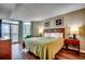 Bright bedroom with a queen bed, wood floors, balcony access, and great views of the ocean at 5300 N Ocean Blvd. N # 1120, Myrtle Beach, SC 29577