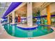 Indoor pool with tropical decor, a lazy river, and a variety of water features at 5300 N Ocean Blvd. N # 1120, Myrtle Beach, SC 29577