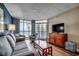Cozy living room featuring couch, armchairs, a TV, and breathtaking ocean views at 5300 N Ocean Blvd. N # 1120, Myrtle Beach, SC 29577