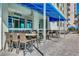 Outdoor patio area with tables, chairs, and shade, perfect for relaxation and dining at 5300 N Ocean Blvd. N # 1120, Myrtle Beach, SC 29577