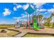 Community playground featuring climbing structures, a slide, and soft ground cover at 5300 N Ocean Blvd. N # 1120, Myrtle Beach, SC 29577