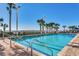 Sparkling outdoor pool surrounded by lush landscaping and ocean views at 5300 N Ocean Blvd. N # 1120, Myrtle Beach, SC 29577