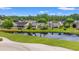 Scenic backyard view, showcasing pond access and lush greenery, perfect for relaxation at 535 Wildflower Trail, Myrtle Beach, SC 29579