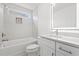 Modern bathroom featuring sleek vanity, tub with tiled surround, and shower at 535 Wildflower Trail, Myrtle Beach, SC 29579