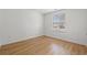 Well-lit bedroom with wood floors and large window with blinds at 535 Wildflower Trail, Myrtle Beach, SC 29579