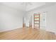Bedroom with tray ceiling, closet, and sliding glass door to bathroom at 535 Wildflower Trail, Myrtle Beach, SC 29579