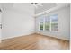 Bright bedroom with large windows, tray ceiling, and wood-look flooring at 535 Wildflower Trail, Myrtle Beach, SC 29579