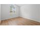 Bedroom with wood floors and window with arch and blinds at 535 Wildflower Trail, Myrtle Beach, SC 29579