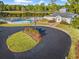 Aerial view of the community clubhouse with an outdoor pool and lush landscaping at 535 Wildflower Trail, Myrtle Beach, SC 29579