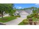 Charming home featuring lush landscaping, a two-car garage, and a well-maintained front yard at 535 Wildflower Trail, Myrtle Beach, SC 29579