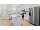 Well-lit kitchen featuring an island, stainless steel appliances, and ample cabinet space with a modern design at 535 Wildflower Trail, Myrtle Beach, SC 29579