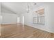 Bright living room featuring light wood floors, neutral walls, and large windows, creating an inviting space at 535 Wildflower Trail, Myrtle Beach, SC 29579