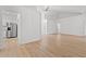 Open-concept living space with wood floors and white walls leading to the kitchen, providing ample room at 535 Wildflower Trail, Myrtle Beach, SC 29579