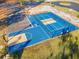 Aerial view showcasing a basketball and pickleball court with parking in a community at 535 Wildflower Trail, Myrtle Beach, SC 29579